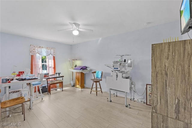 interior space with ceiling fan and light hardwood / wood-style floors