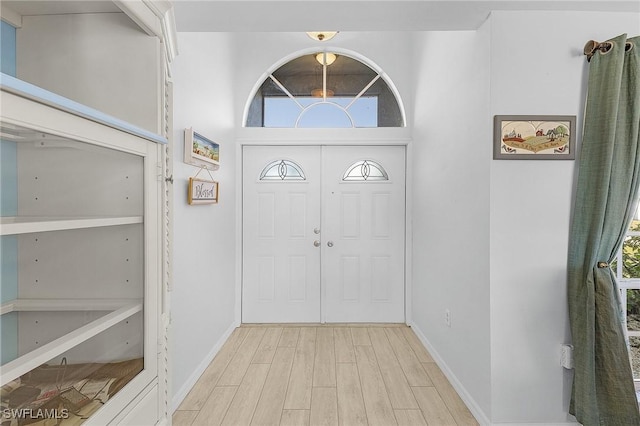 entrance foyer with light hardwood / wood-style floors