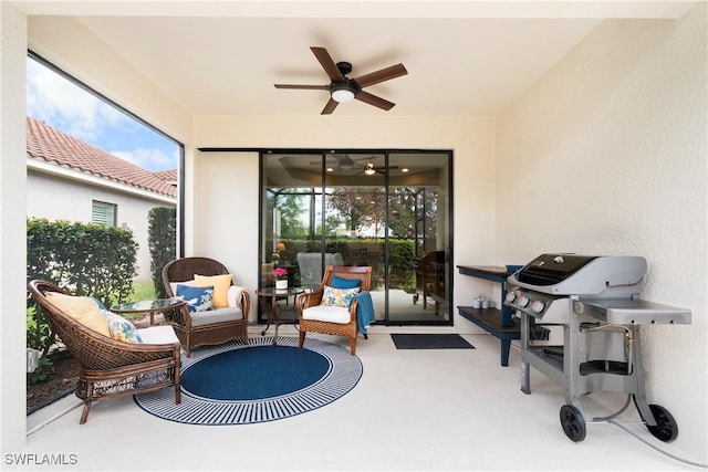 view of patio / terrace featuring a ceiling fan, area for grilling, and an outdoor hangout area