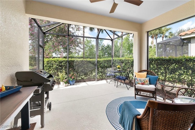 sunroom / solarium with ceiling fan