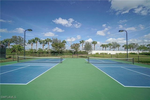 view of sport court with fence