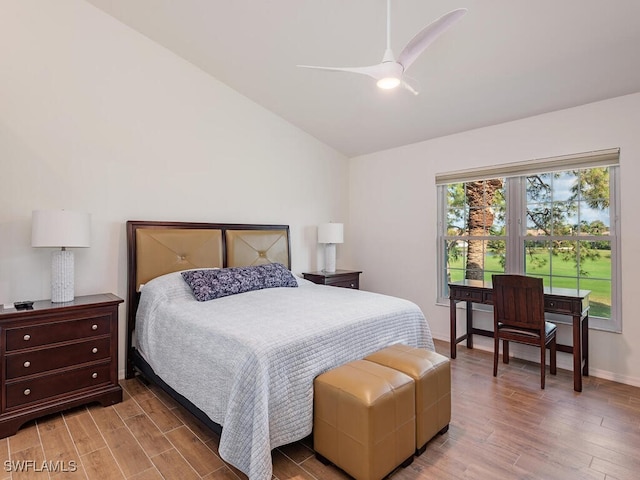 bedroom featuring ceiling fan, wood-type flooring, and vaulted ceiling