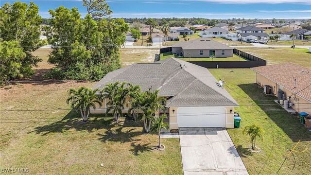 birds eye view of property with a residential view