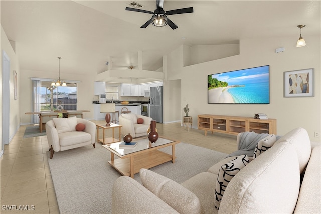 living room featuring high vaulted ceiling, ceiling fan with notable chandelier, and light tile patterned floors