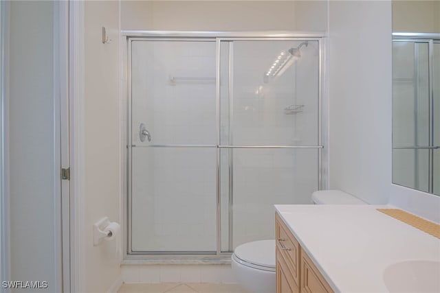19930 Barletta Ln Unit 1324, Estero, FL 33928 - bathroom featuring vanity, a shower stall, toilet, and tile patterned flooring