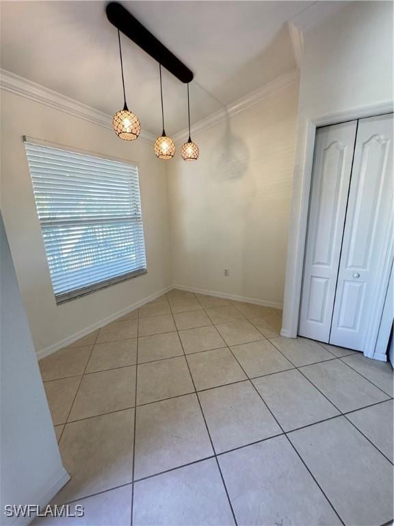 19930 Barletta Ln Unit 1324, Estero, FL 33928 - unfurnished dining area with light tile patterned flooring, baseboards, and ornamental molding