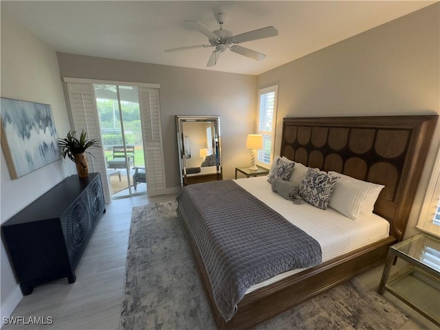 bedroom with access to outside, baseboards, ceiling fan, and light wood finished floors