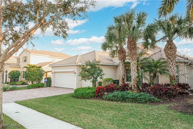 view of front of property featuring a garage and a front yard