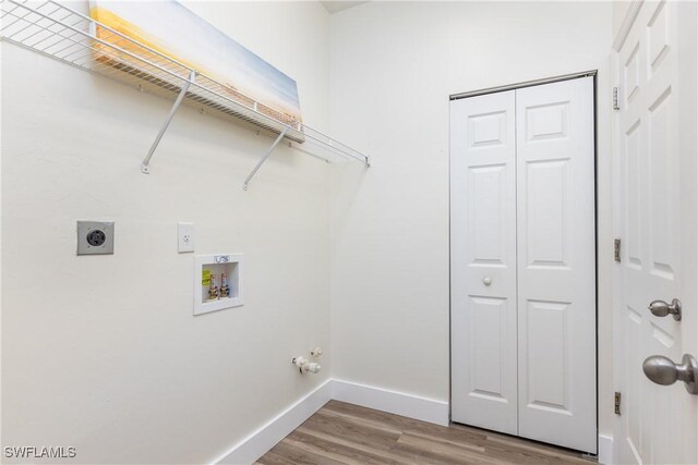 laundry area with hardwood / wood-style floors, hookup for a washing machine, and hookup for an electric dryer