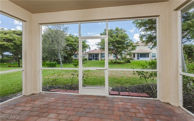 unfurnished sunroom featuring a healthy amount of sunlight