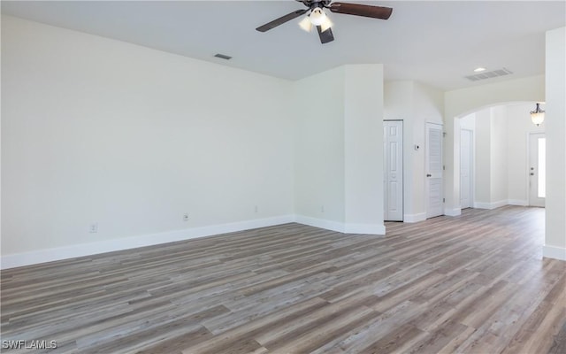 spare room featuring ceiling fan and light wood-type flooring