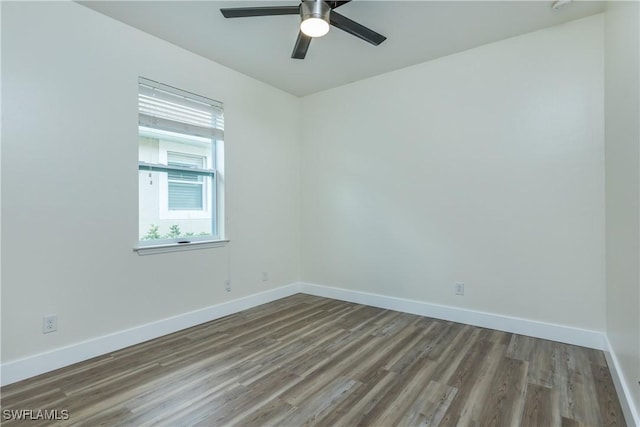 spare room featuring ceiling fan and hardwood / wood-style floors