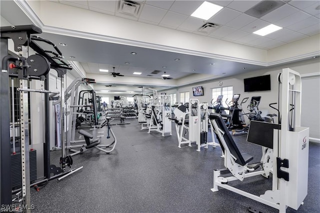 workout area featuring a drop ceiling and a tray ceiling