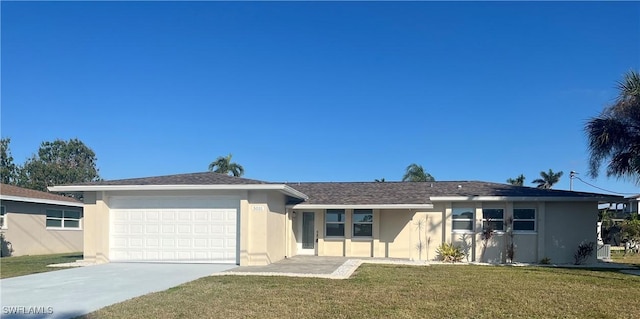 single story home with a garage and a front lawn