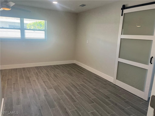 spare room with a barn door