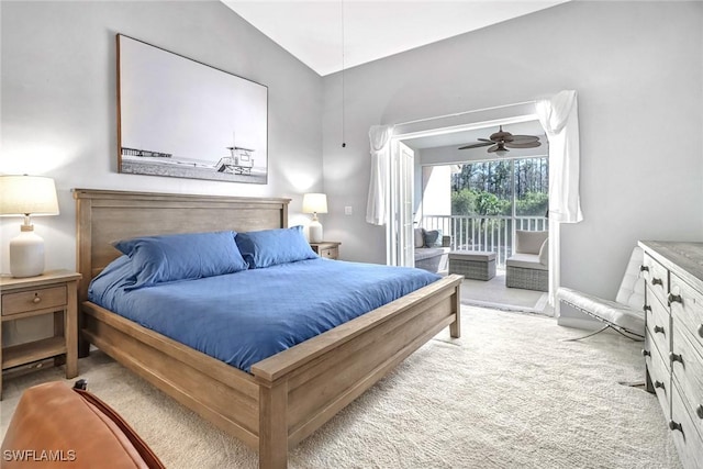 carpeted bedroom with vaulted ceiling, a ceiling fan, and access to outside