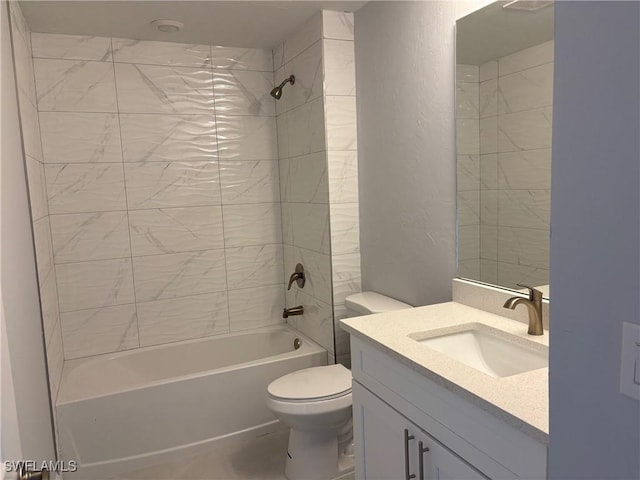 full bathroom featuring vanity, toilet, and tiled shower / bath combo