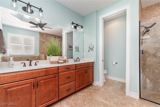 bathroom with walk in shower, ceiling fan, vanity, and toilet