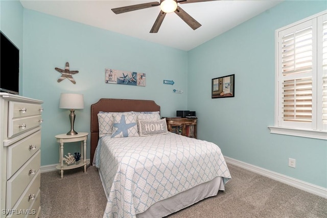 bedroom featuring ceiling fan and light carpet