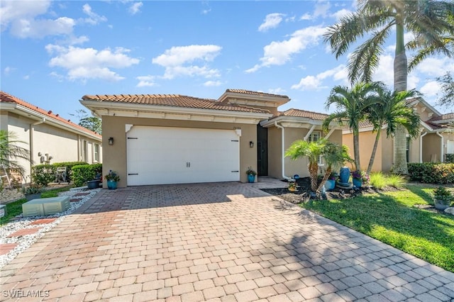 mediterranean / spanish-style home featuring a garage