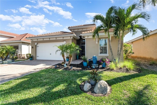 mediterranean / spanish home featuring a garage and a front lawn