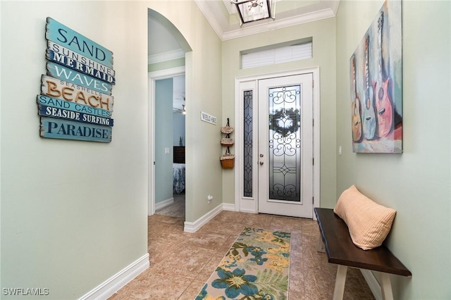 entryway featuring crown molding and light tile patterned floors