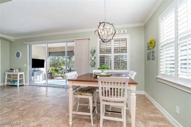 dining space featuring crown molding and an inviting chandelier