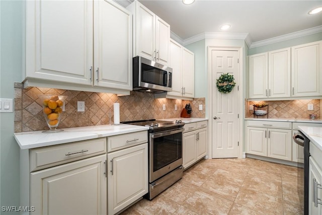 kitchen with crown molding, appliances with stainless steel finishes, backsplash, and white cabinets