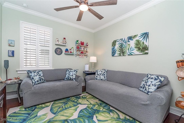 living room with ornamental molding, wood-type flooring, and ceiling fan