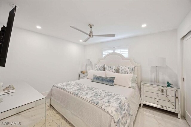 bedroom featuring ceiling fan, marble finish floor, and recessed lighting