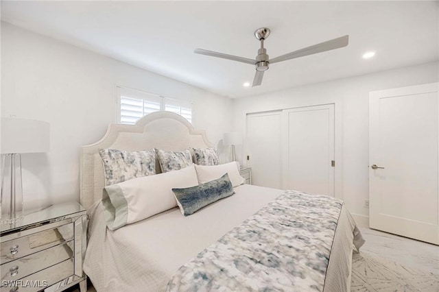 bedroom featuring ceiling fan, marble finish floor, a closet, and recessed lighting