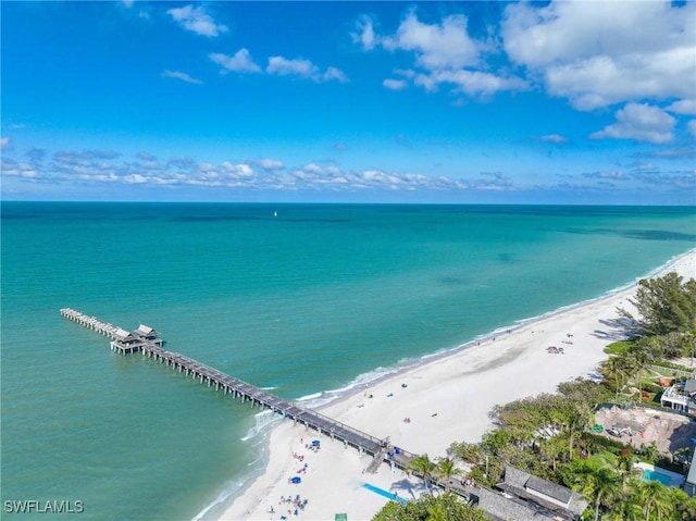 drone / aerial view featuring a view of the beach and a water view