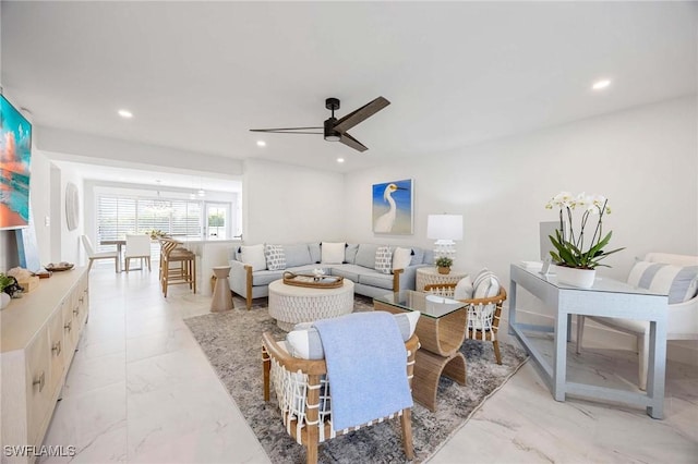 living area with recessed lighting, marble finish floor, and ceiling fan