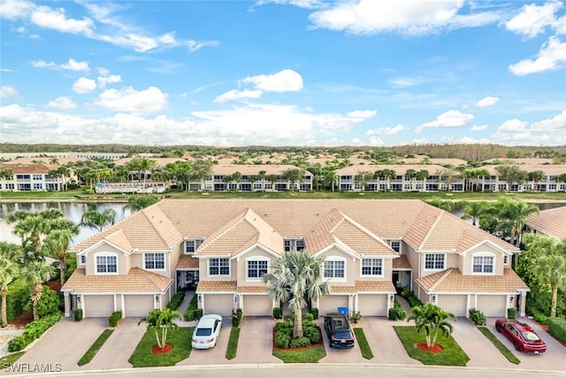 aerial view with a water view and a residential view