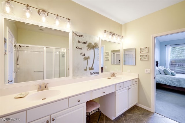 ensuite bathroom with a sink, a stall shower, ensuite bath, and tile patterned floors