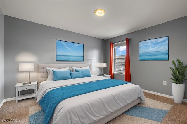 bedroom featuring carpet flooring and baseboards