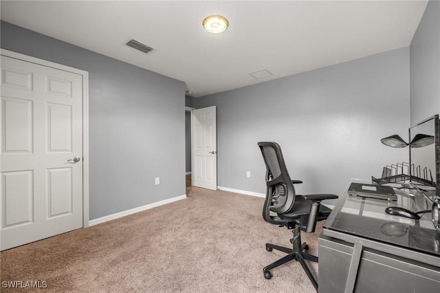 office space featuring carpet floors, visible vents, and baseboards