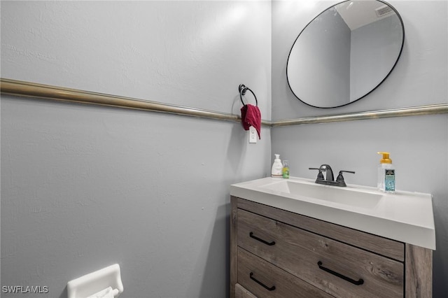 bathroom featuring visible vents and vanity