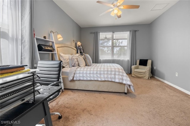 carpeted bedroom with a ceiling fan, visible vents, and baseboards