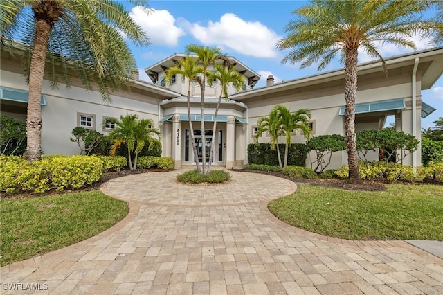 view of front of house with french doors and stucco siding