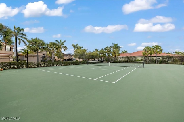 view of sport court featuring fence