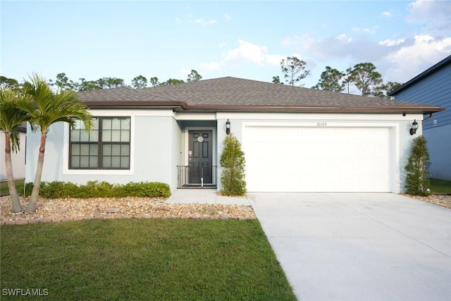 single story home with a garage and a front lawn