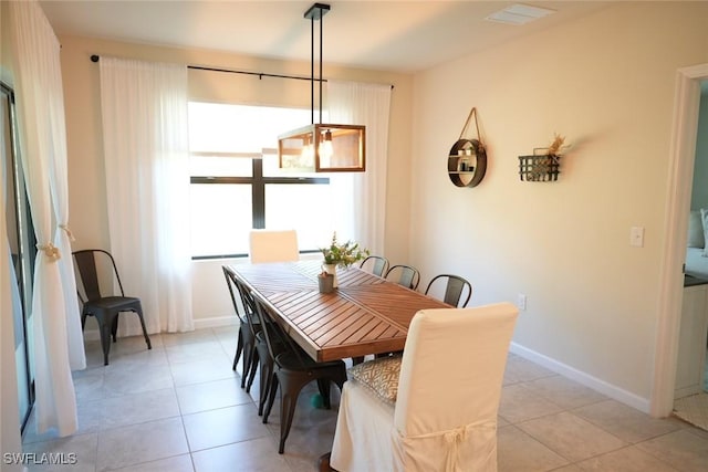 dining area featuring light tile patterned flooring