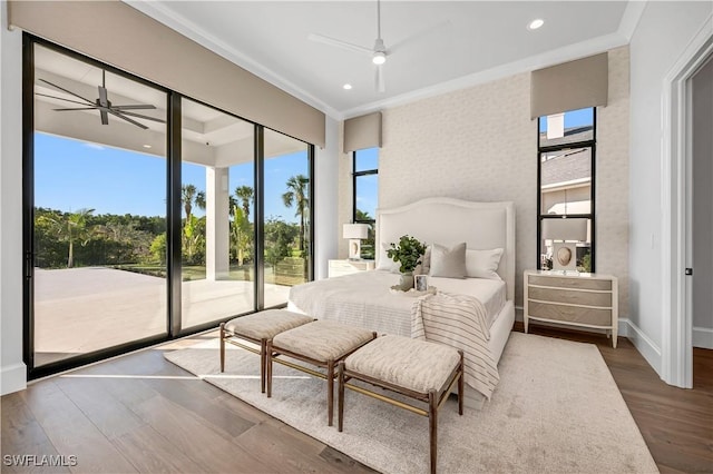 bedroom with ceiling fan, access to outside, ornamental molding, and wood-type flooring