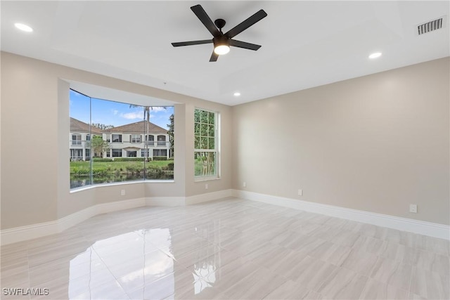 spare room with ceiling fan