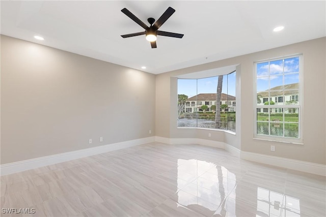 unfurnished room featuring ceiling fan