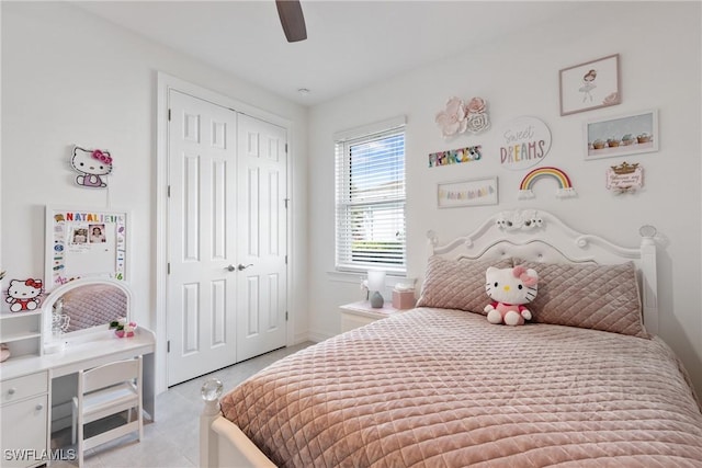 tiled bedroom with a closet and ceiling fan