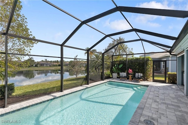 view of pool featuring a patio area, a water view, and glass enclosure