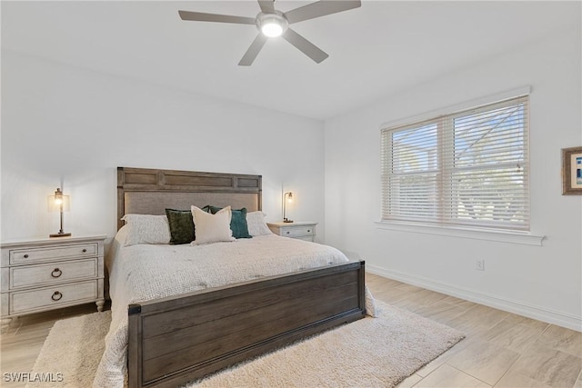 bedroom featuring ceiling fan and light hardwood / wood-style floors