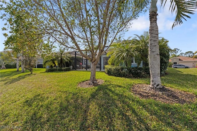 view of yard featuring a lanai